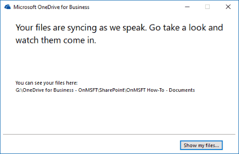 Captura de pantalla que muestra el cliente de sincronización de OneDrive para la empresa "estamos sincronizando" pantalla