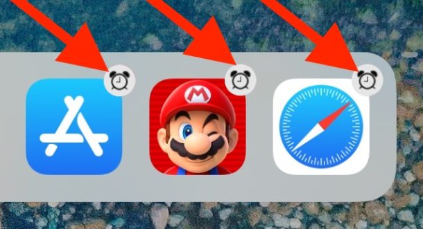 Iconos de la base de iPad con un icono de placa de reloj de alarma en ellos 